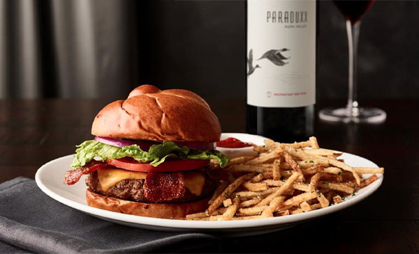 Burger and Wine Pair'fection - The classic burger & wine pairing, taken to a new level. Enjoy our mouth-watering Prime Burger, a combination of USDA prime beef, Wisconsin cheddar cheese and peppered bacon, accompanied by a glass of Paraduxx, a Proprietary Red Blend from Napa Valley. Available exclusively in the bar, now through May 10. $25 per guest.
